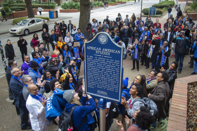 A photo from above the University of Florida African American Studies Historical Marker. Several people are standing around the historical marker celebrating the unveiling.