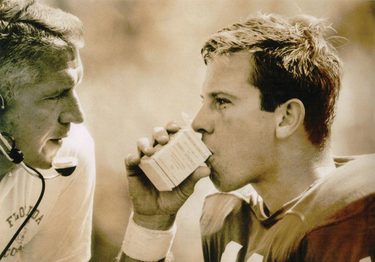 Heisman Trophy winner and longtime Gator coach Steve Spurrier drinks Gatorade from a milk carton on the sidelines during a game in 1966.