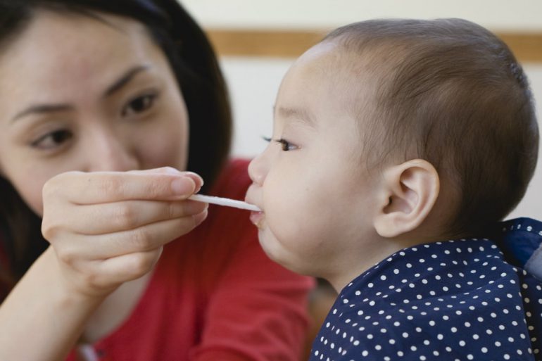 mom feeding baby