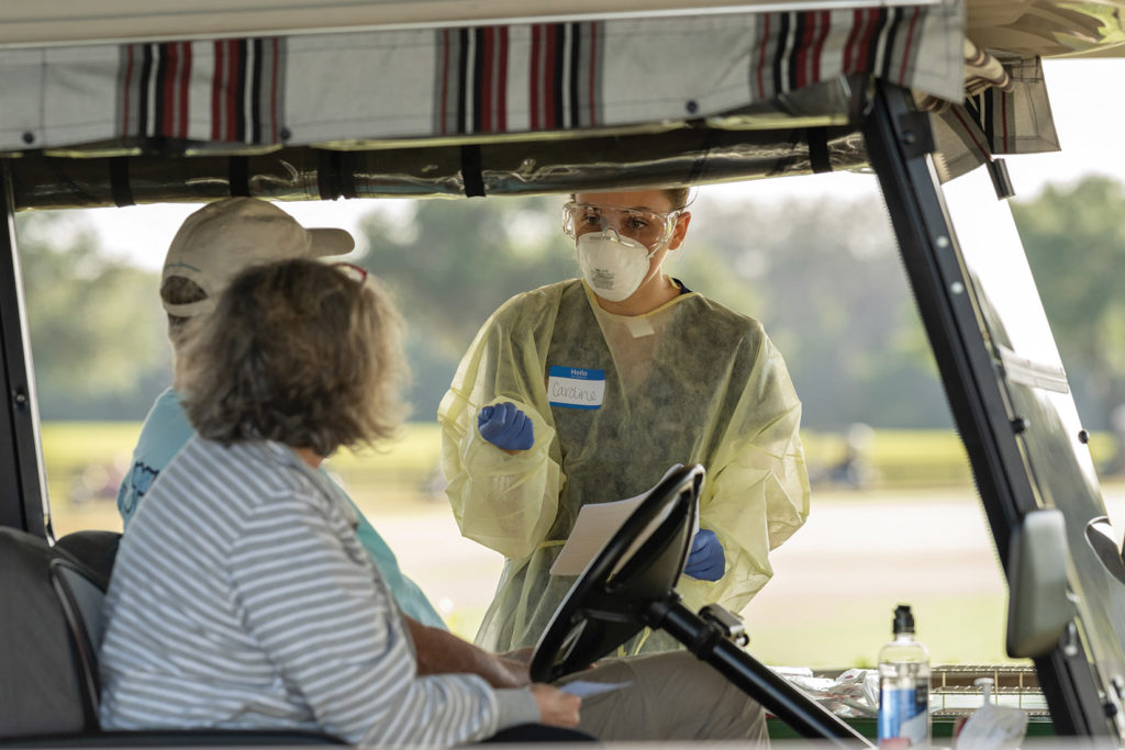 UF Health volunteer administers COVID-19 tests to residents of The Villages.