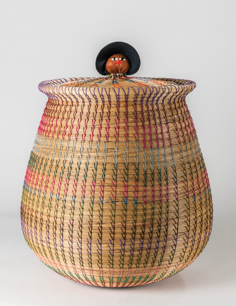 Close-up image of a Seminole coiled basket against a white background.