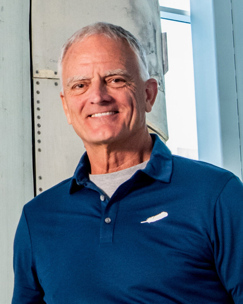 Portrait of Rob Ferl wearing Blue Origin polo shirt.