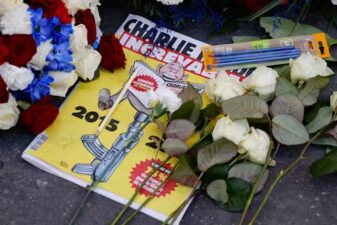 A photo of a special edition of French satirical newspaper Charlie Hebdo commemorates 10 years since an Islamist attack in 2015.